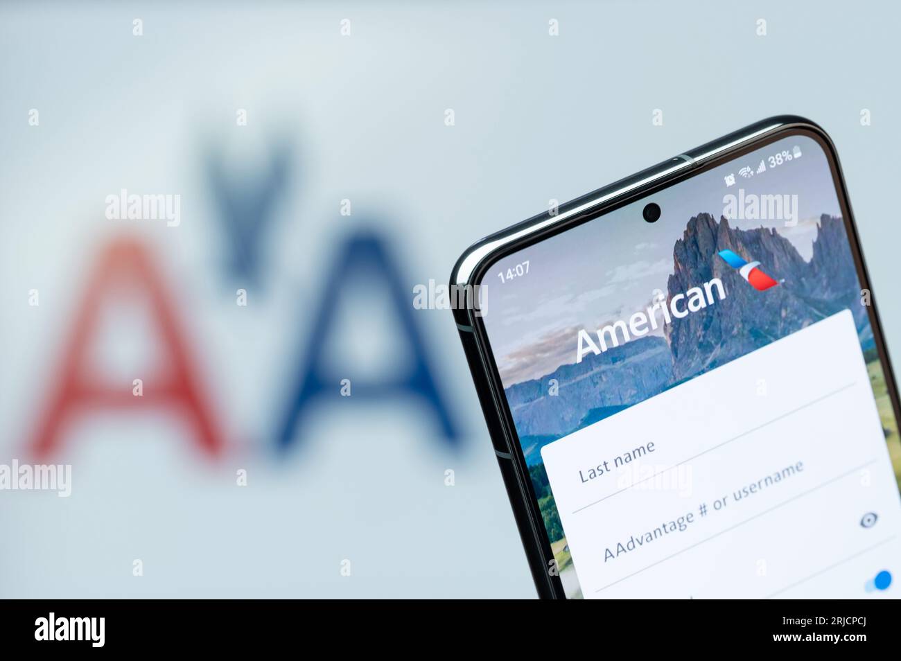 New York, USA - August 20, 2023: Booking flight in American airline app on smartphone display close up with blurred logo background Stock Photo