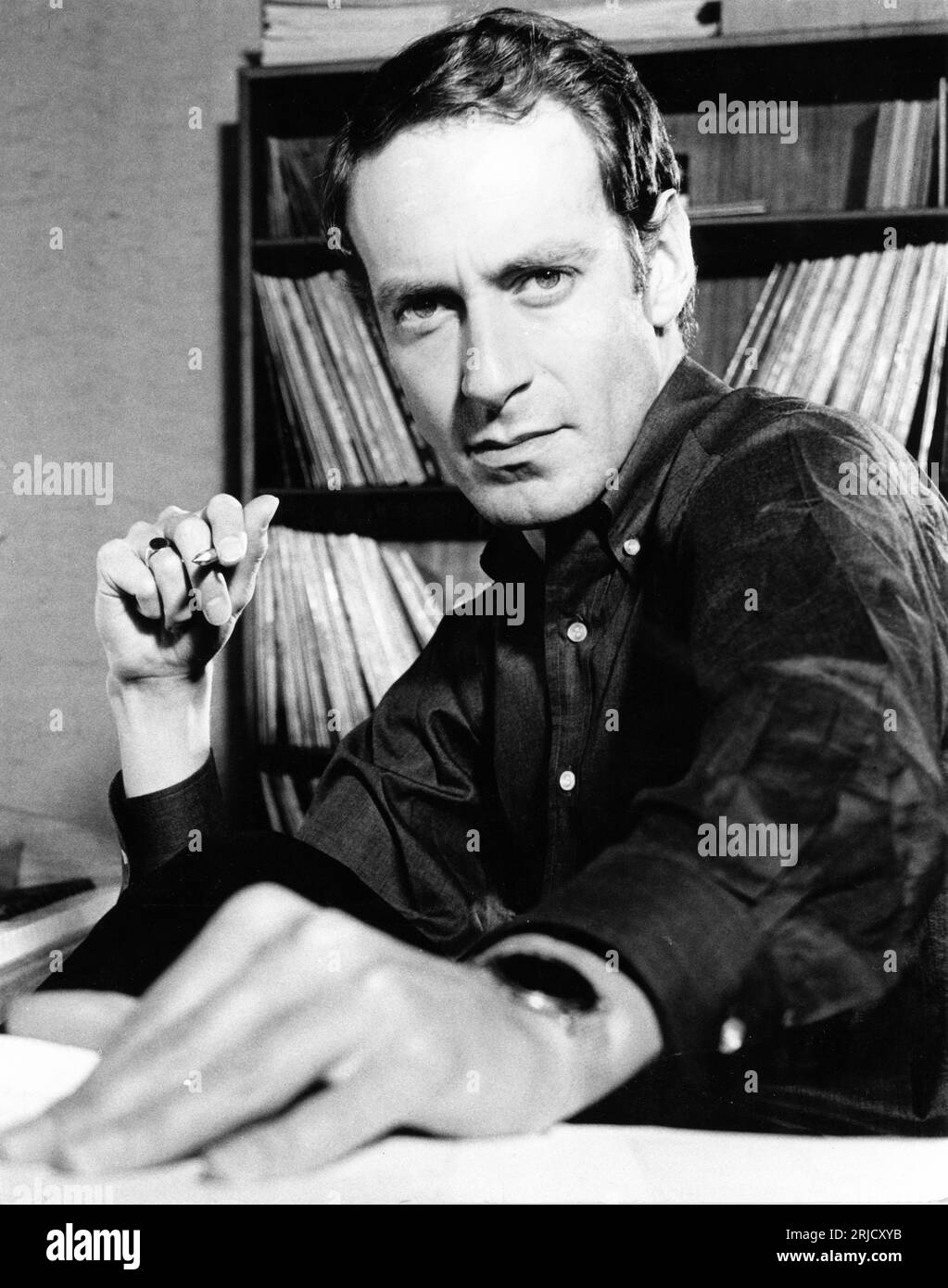 Film Composer JOHN BARRY candid portrait at home in September 1964 by CLIFFORD JONES STUDIOS LTD., London SW1 Stock Photo