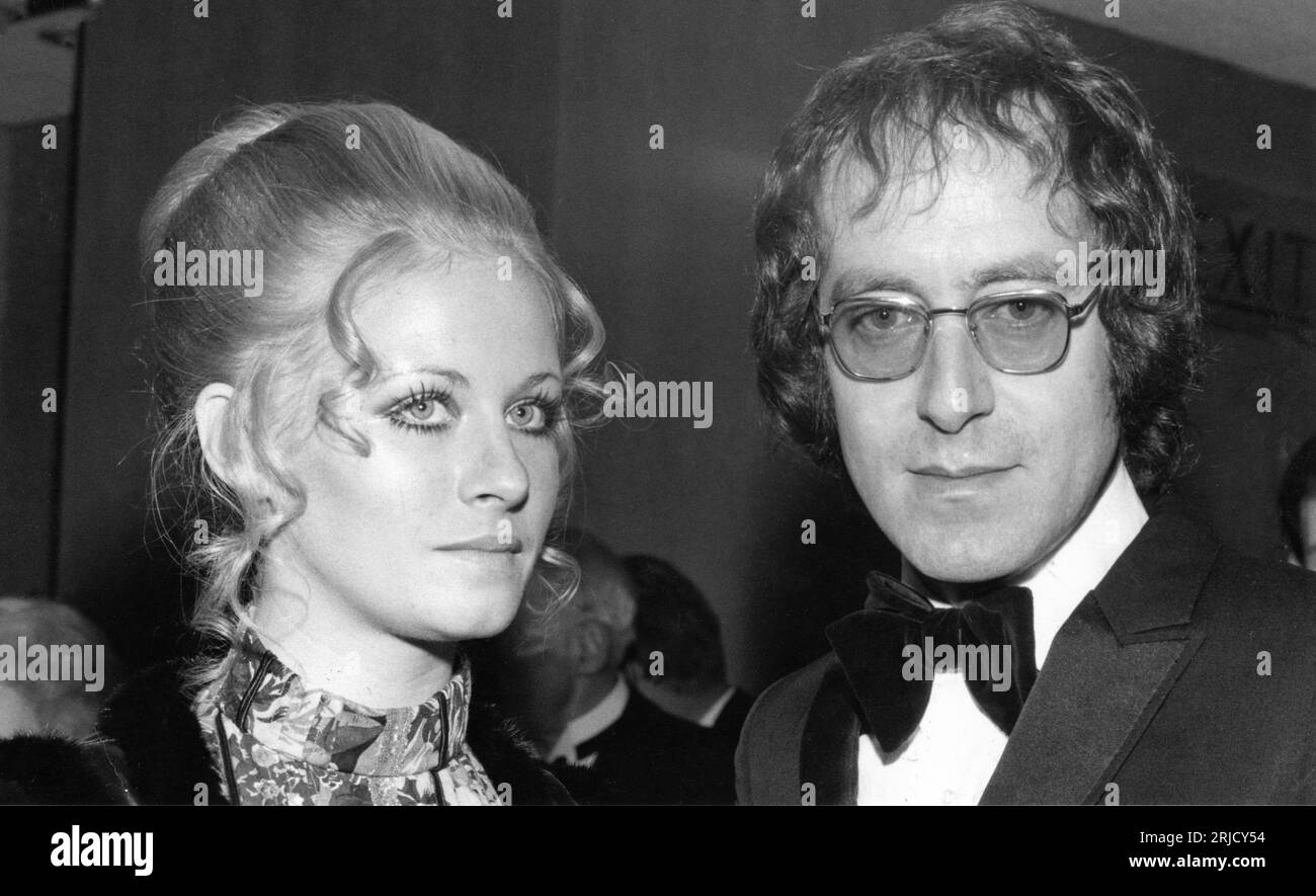 Film Composer JOHN BARRY with his 3rd wife JANE SIDEY at film premiere in 1969 (likely OHMSS on December 18th) from P.I.C. Photos Ltd. 280 Uxbridge Road, London W12 Stock Photo