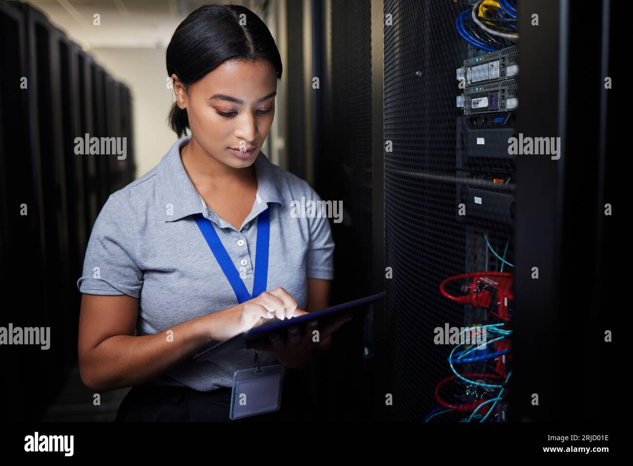 Woman, tablet and server room, programming or coding for cybersecurity, information technology or data protection backup. Engineering person on Stock Photo