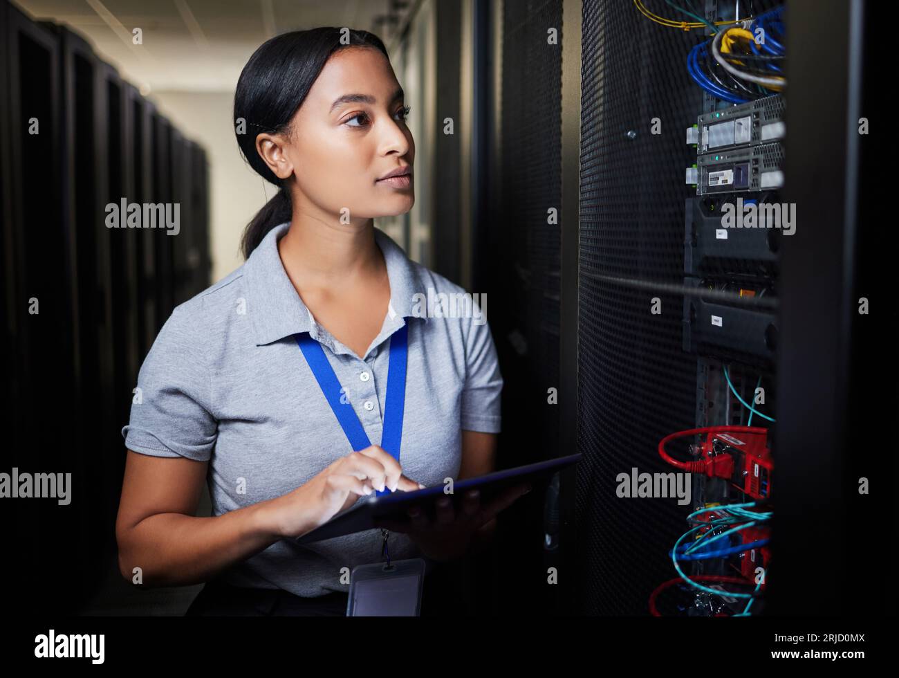 Woman, tablet and thinking in server room, programming solution or coding ideas for cybersecurity or data center backup. Engineering person on digital Stock Photo
