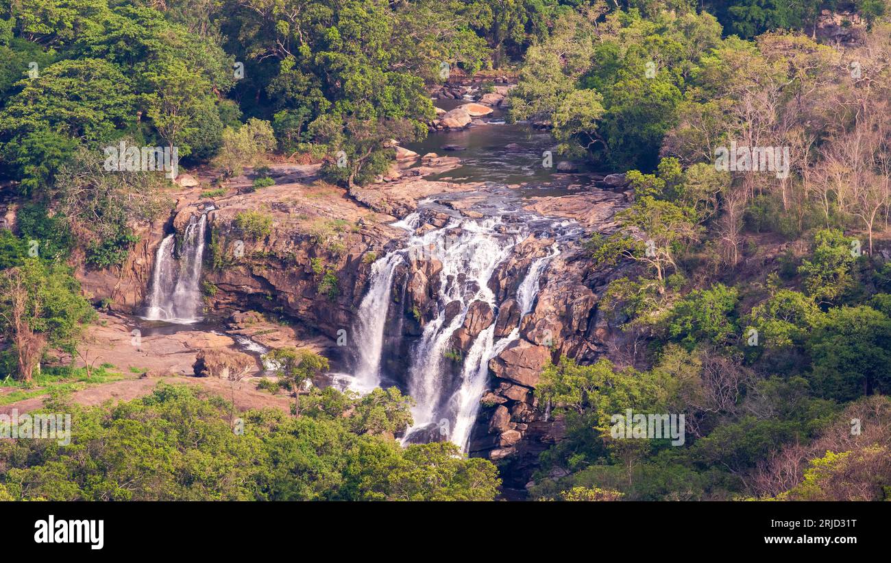 A scenic waterfall at Thoovanam,Munnar,Kerala,India.This beautiful waterfall is inside the dense reserve forest of Munnar. Stock Photo