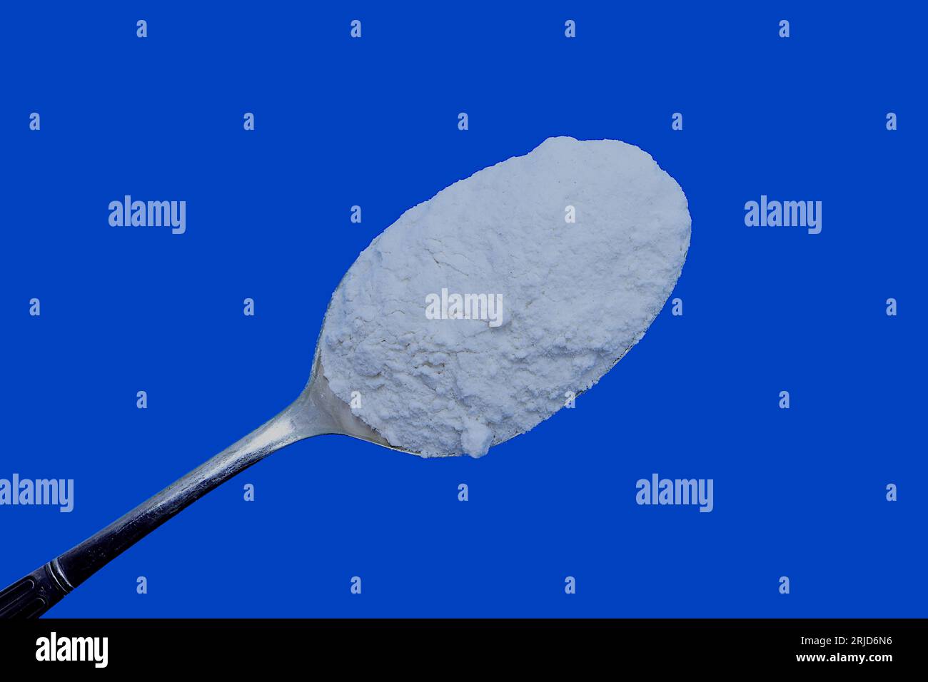 Home baking ingredients Self raising white flour set against a blue