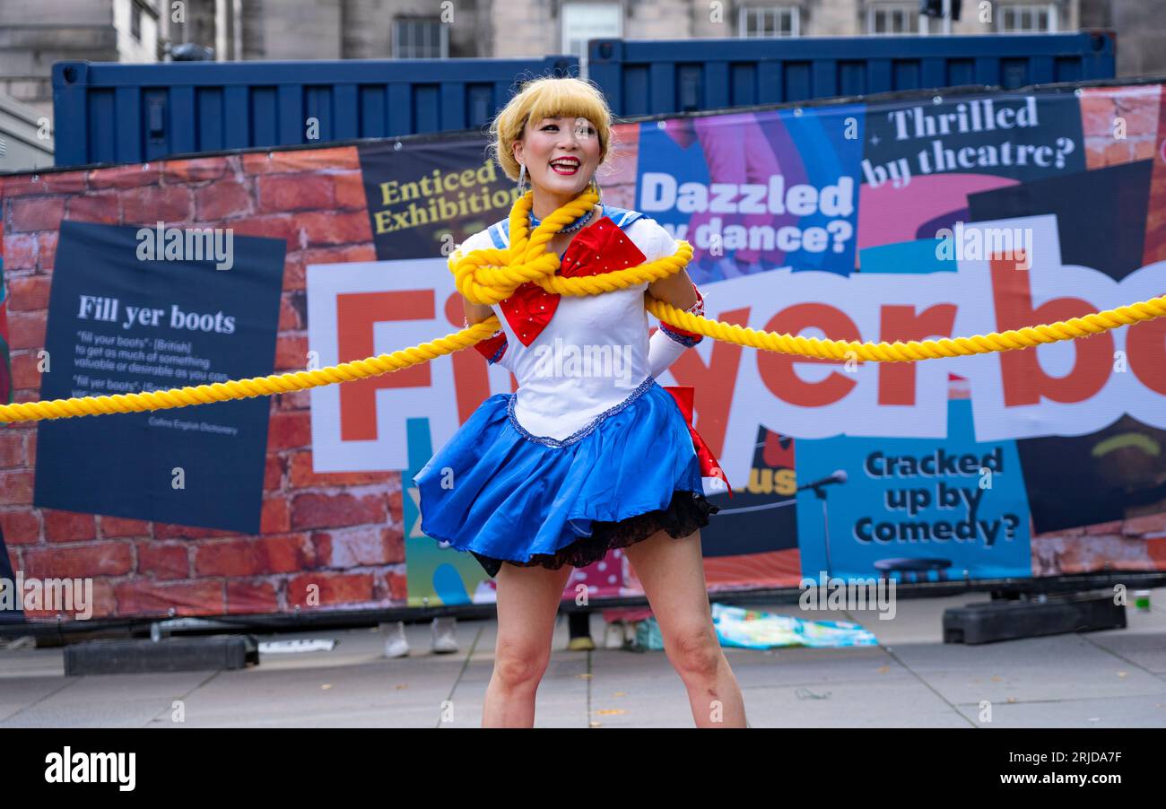 Edinburgh, Scotland, UK. 22nd August 2023. Street performers and actors promoting shows on the Royal Mile during the 3rd week of the Edinburgh Fringe Festival. Pic;  Japanese street performers the Teriyaki Girls entertain the public on the Royal Mile. Iain Masterton/Alamy Live News Stock Photo