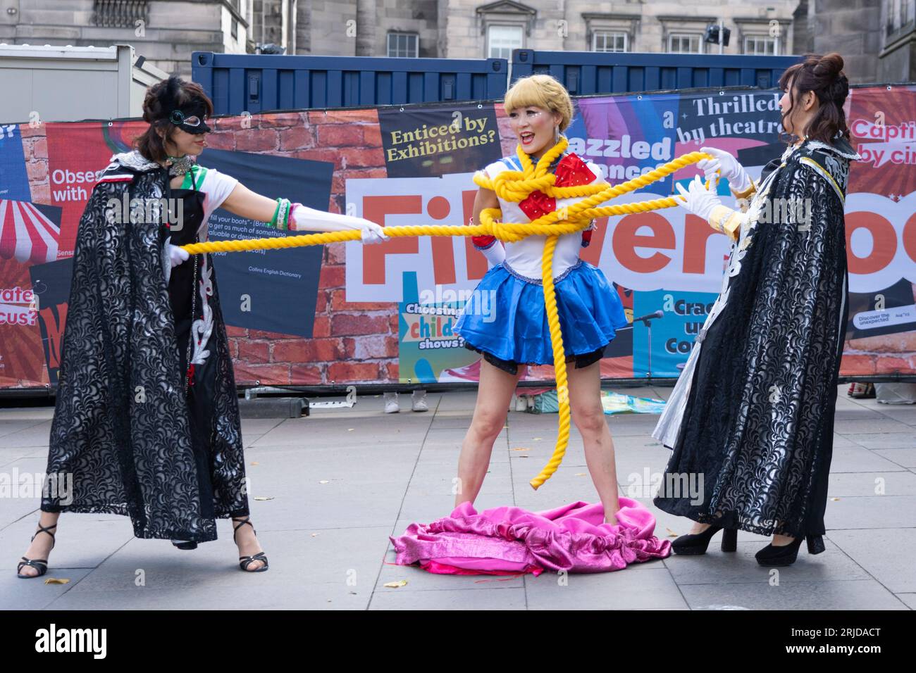Edinburgh, Scotland, UK. 22nd August 2023. Street performers and actors promoting shows on the Royal Mile during the 3rd week of the Edinburgh Fringe Festival. Pic;  Japanese street performers the Teriyaki Girls entertain the public on the Royal Mile. Iain Masterton/Alamy Live News Stock Photo