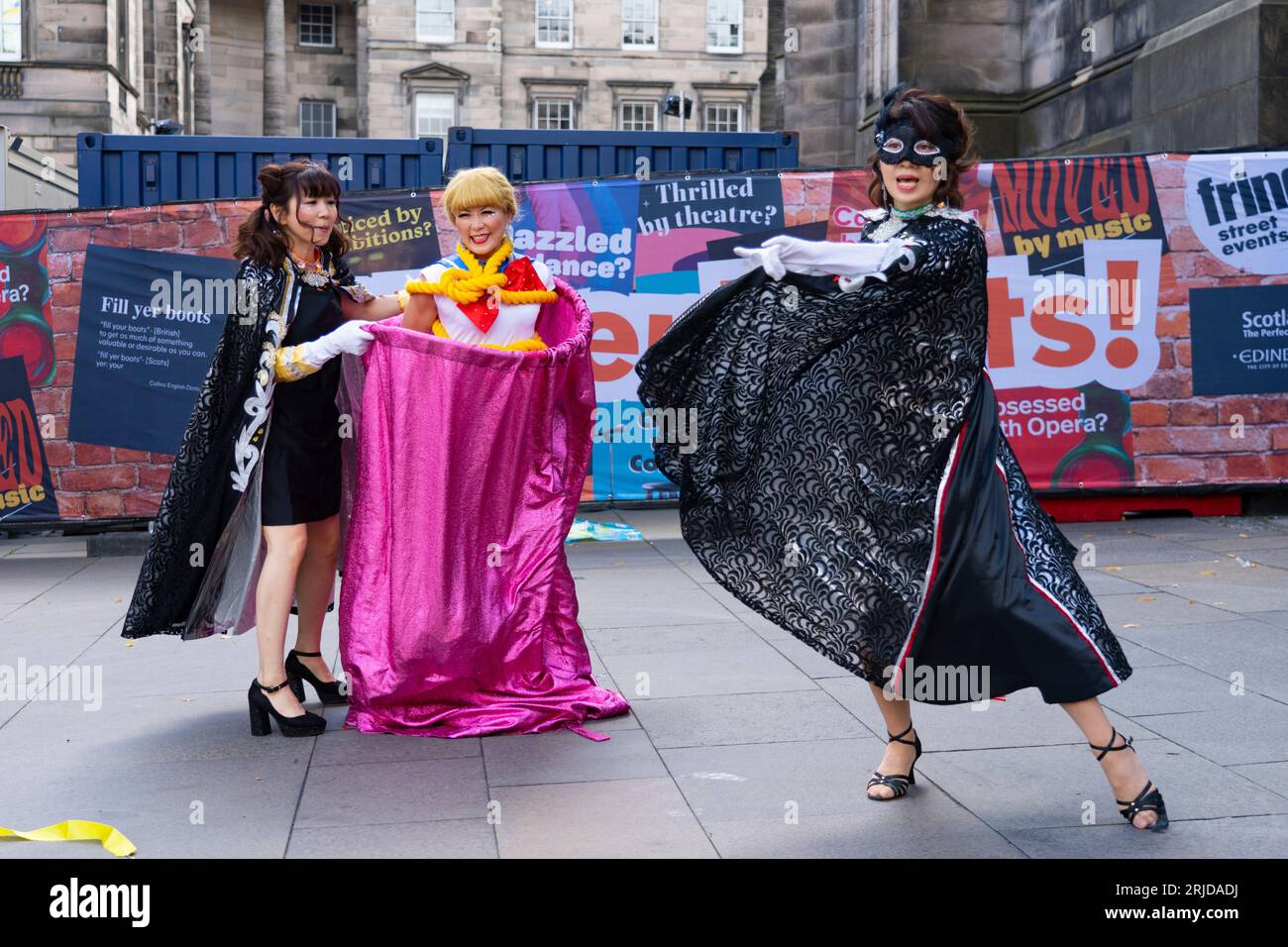 Edinburgh, Scotland, UK. 22nd August 2023. Street performers and actors promoting shows on the Royal Mile during the 3rd week of the Edinburgh Fringe Festival. Pic;  Japanese street performers the Teriyaki Girls entertain the public on the Royal Mile. Iain Masterton/Alamy Live News Stock Photo