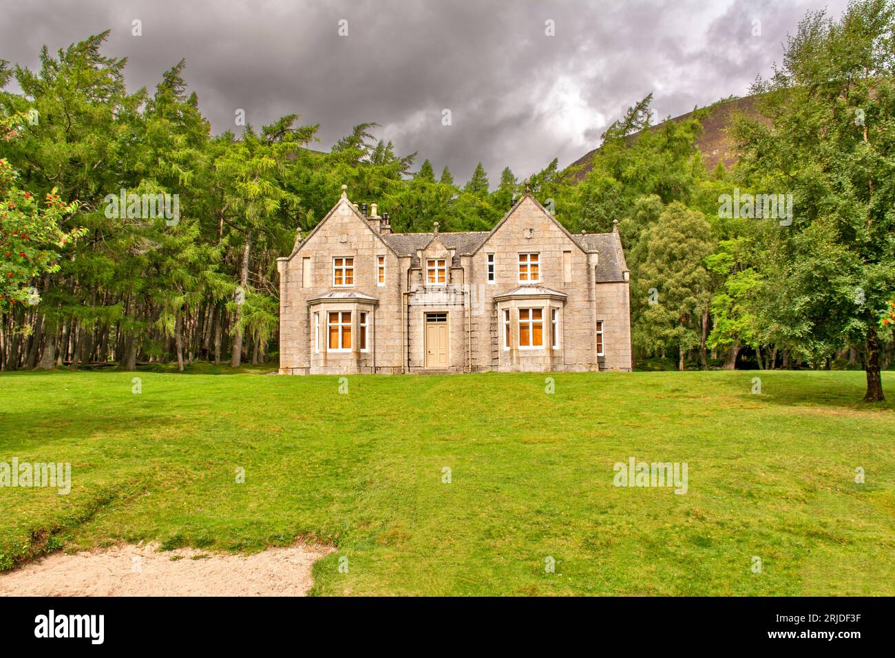 Loch Muick Ballater Balmoral Estate Scotland frontal view of Glas allt Shiel house in summer surrounded by trees Stock Photo