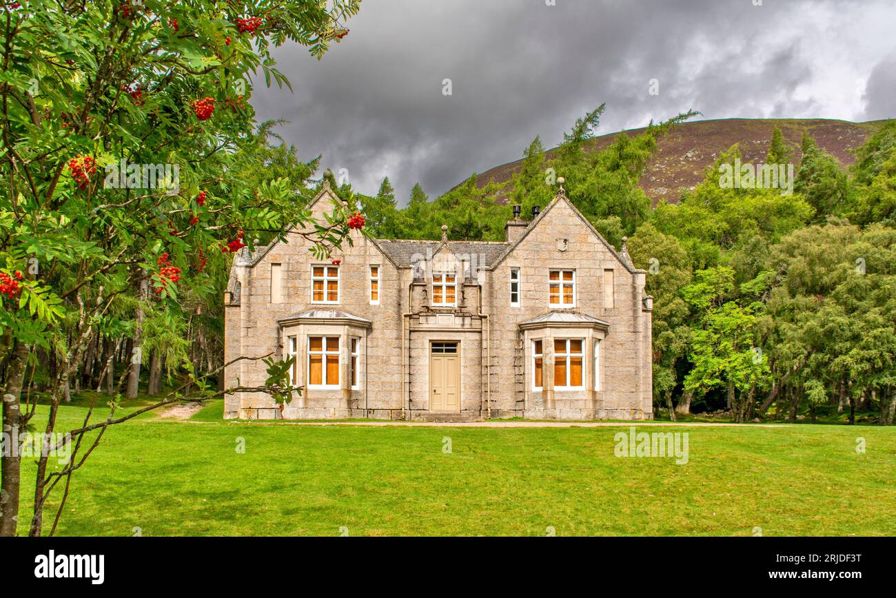 Loch Muick Ballater Balmoral Estate Scotland frontal view of Glas allt Shiel house in summer with red berries on a rowan tree Stock Photo
