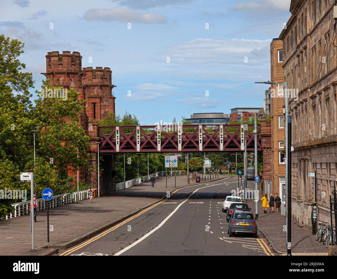 View along Clyde Street in Glasgow, Scotland, showing the approach span of the Caledonian Railway Bridge, which takes trains into Central Station. Stock Photo