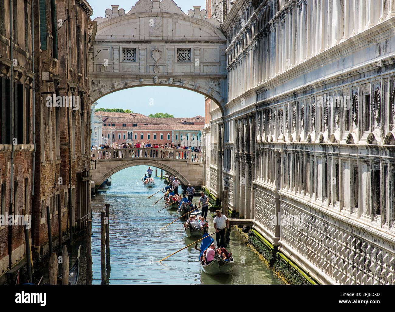 Gondolas pass under The Bridge Of Sighs in Venice, Italy Stock Photo