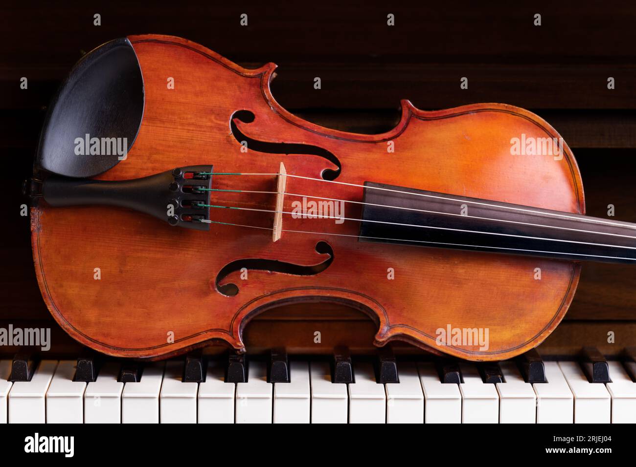 Violin on piano Stock Photo