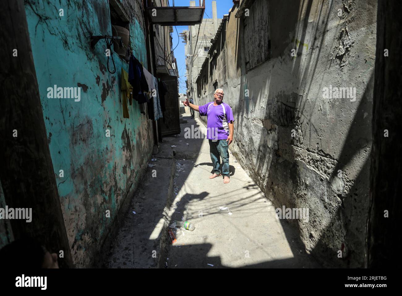 A Palestinian man outside his house in Al-Shati refugee camp, the third largest camp in the Palestinian territories. Stock Photo