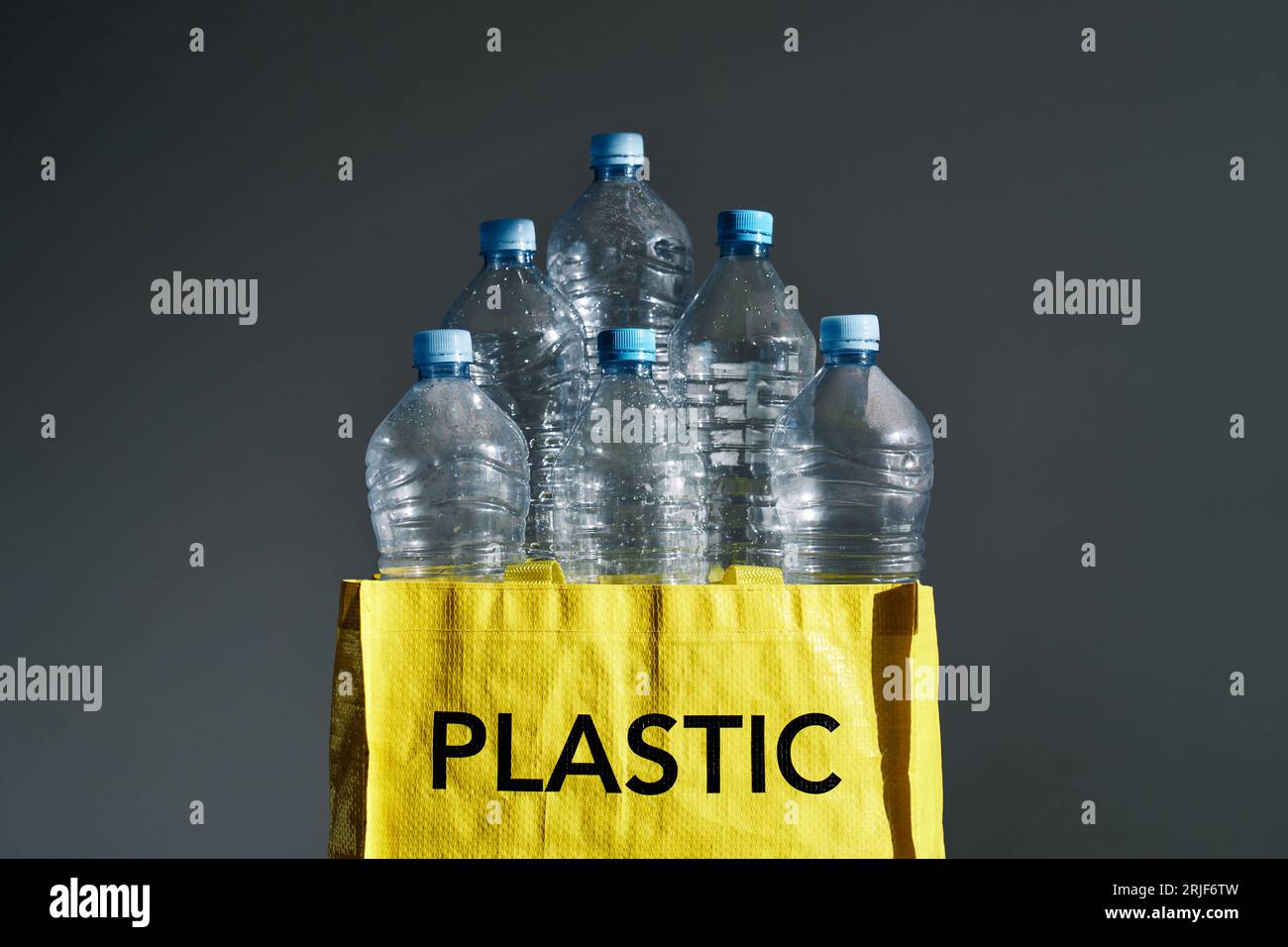 Empty plastic bottles in bag for separate garbage and recycling for