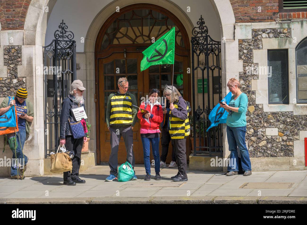 LONDON - April 22, 2023: Uniting for change: Extinction Rebellion protesters gather in preparation for the XR protest rally in London, voicing their c Stock Photo