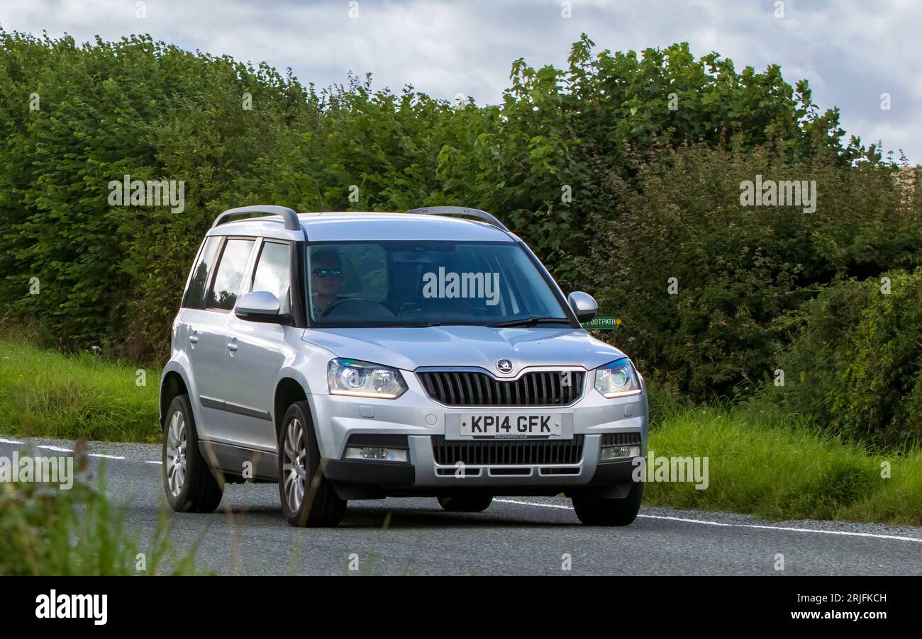 Woburn,Beds.UK - August 19th 2023: 2014 silver diesel engine Skoda Yeti  car travelling on an English country road. Stock Photo