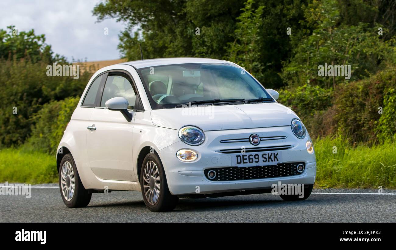 Woburn,Beds.UK - August 19th 2023: 2019 white Fiat 500  car travelling on an English country road. Stock Photo