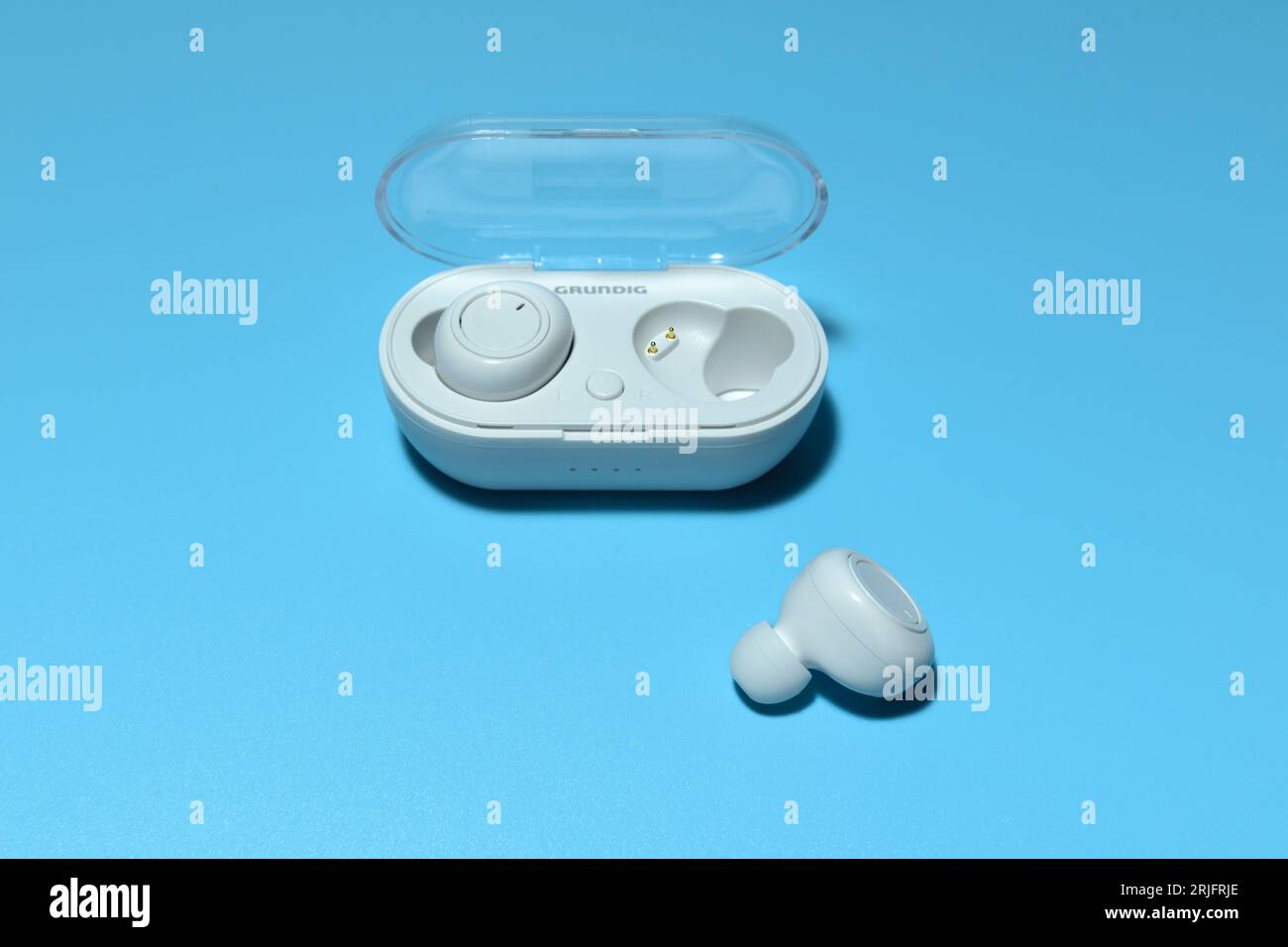 Hasselt. Limburg - Belgium 08-05-2023. Grundig A6 -True Wireless Wireless Earbuds. white on blue background Stock Photo