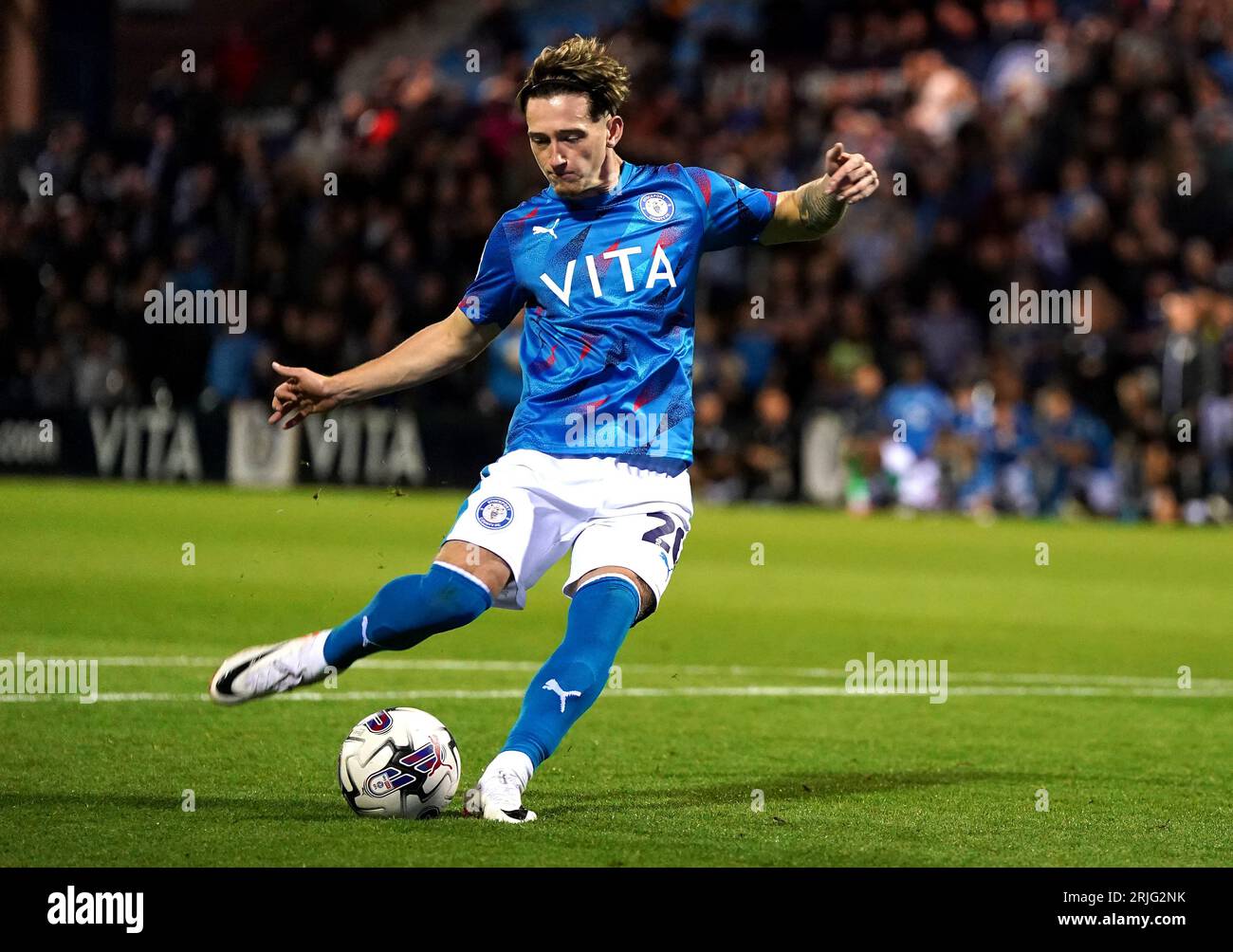 Stockport County's Louie Barry takes a penalty kick during a penalty