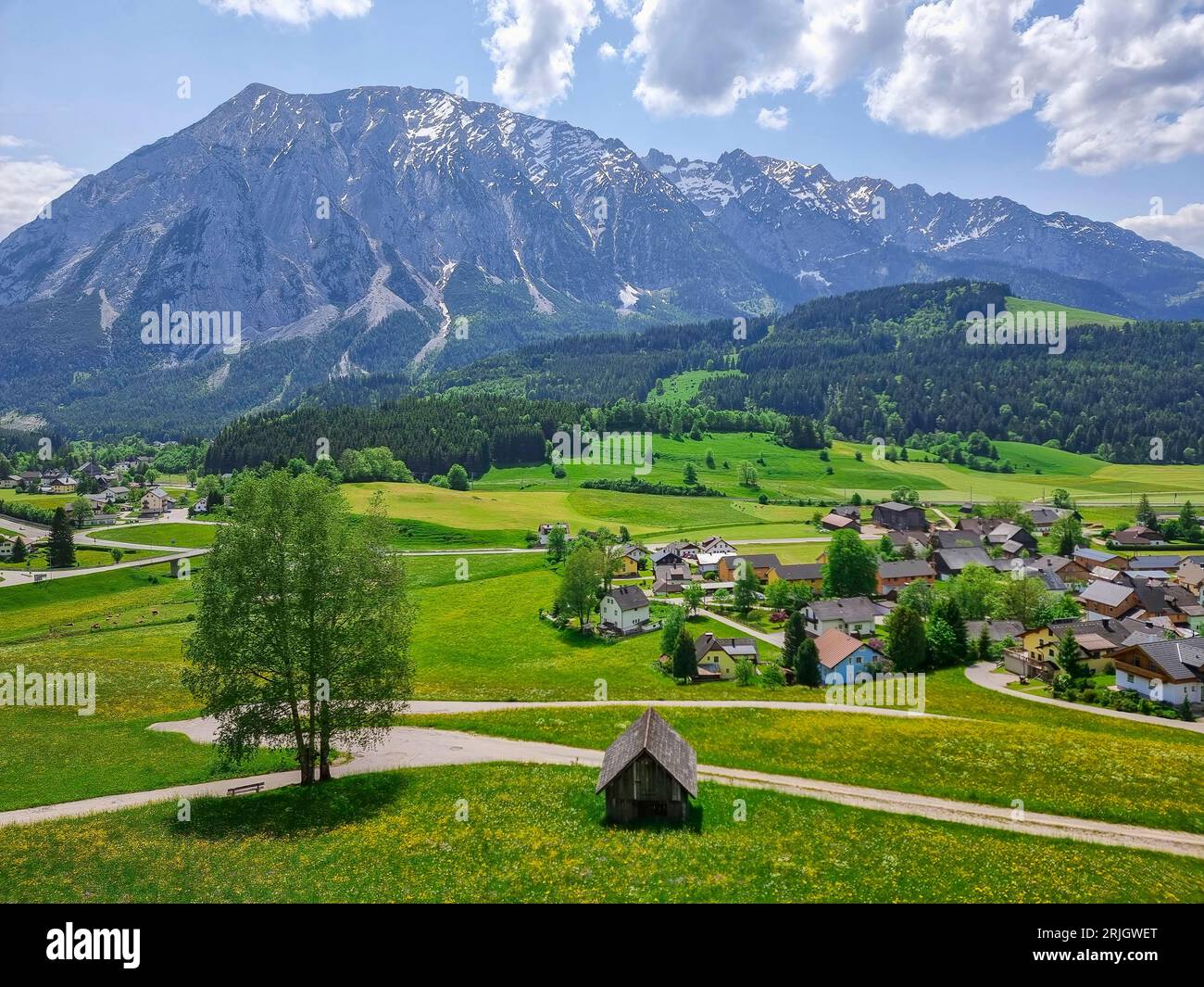 Austrian landscape with Grimming mountain (2.351 m),an isolated peak in the Dachstein Mountains,view from small alpine village Tauplitz,Styria,Austria Stock Photo