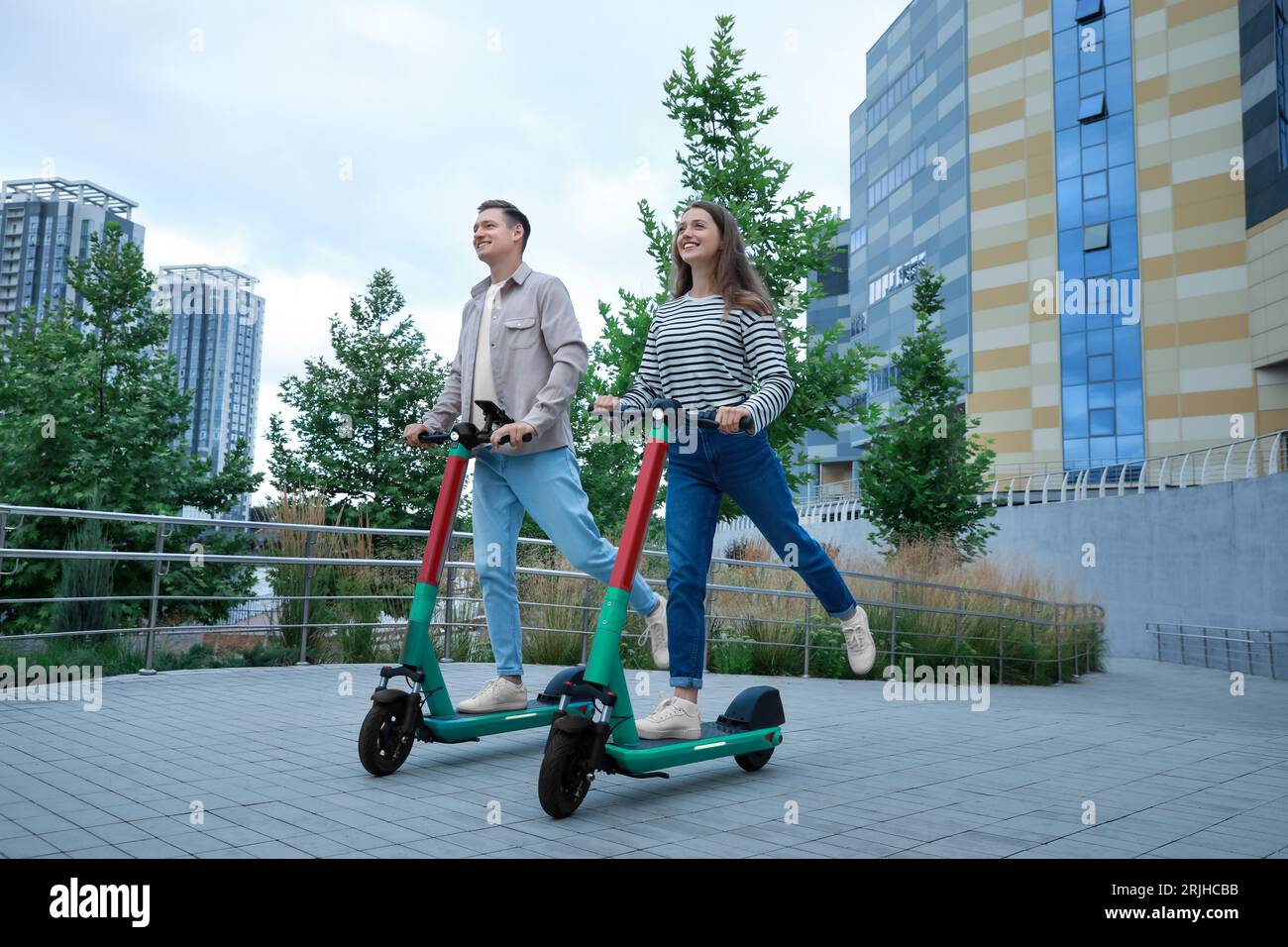 Family on electric scooters hi-res stock photography and images - Alamy