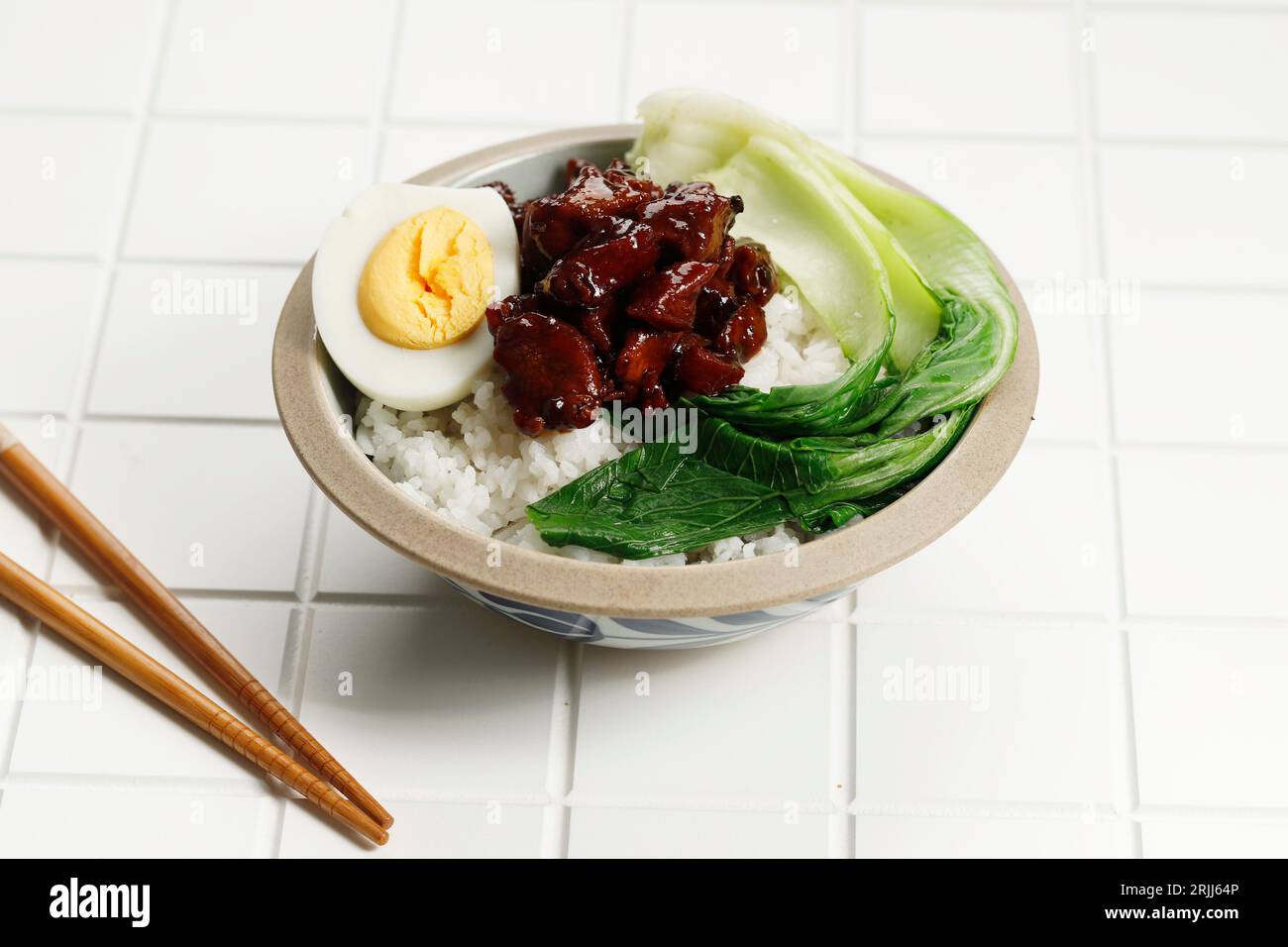 Taiwanese Lu Rou Fan Braised Pork Rice, on White Table Stock Photo
