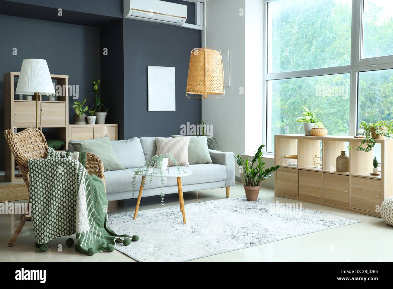 Interior of modern living room with plants, sofa and armchair Stock ...