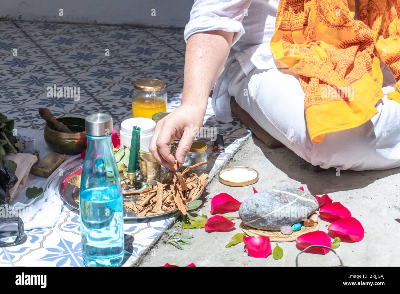An unrecognizable Buddhist monk burning incense in a thank-you ritual ...