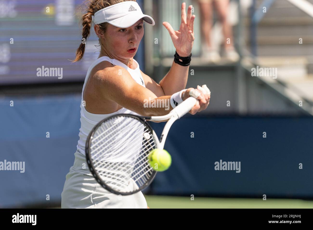 Mary Stoiana of USA returns ball during 1st round match against Victorija Golubic of Switzerland of qualifying for US Open Championship at Billy Jean King Tennis Center in New York on August 22, 2023 Stock Photo