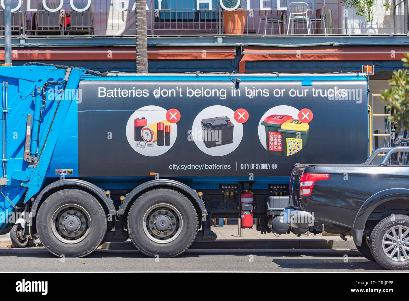 A sign on the side of a garbage truck in central Sydney, Australia
