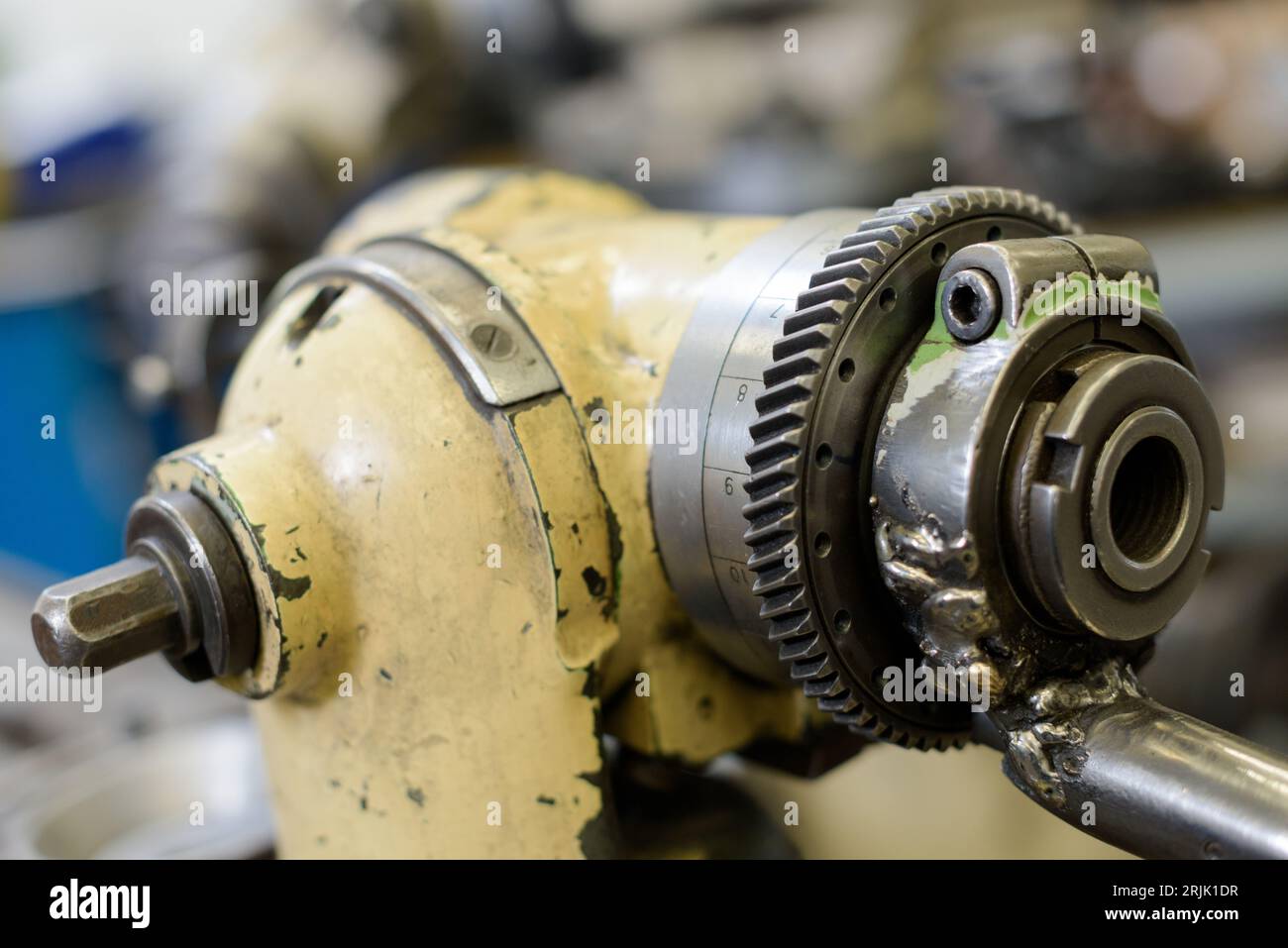 close view of mechanical part with toothed cog and shaft Stock Photo