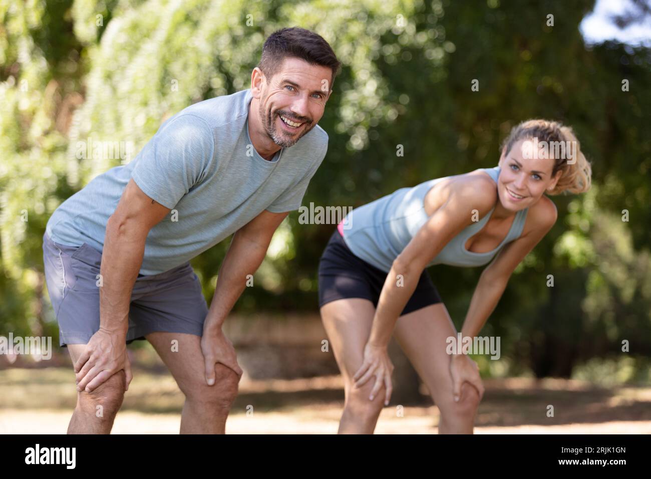 couple jogging and running outdoors in nature Stock Photo - Alamy