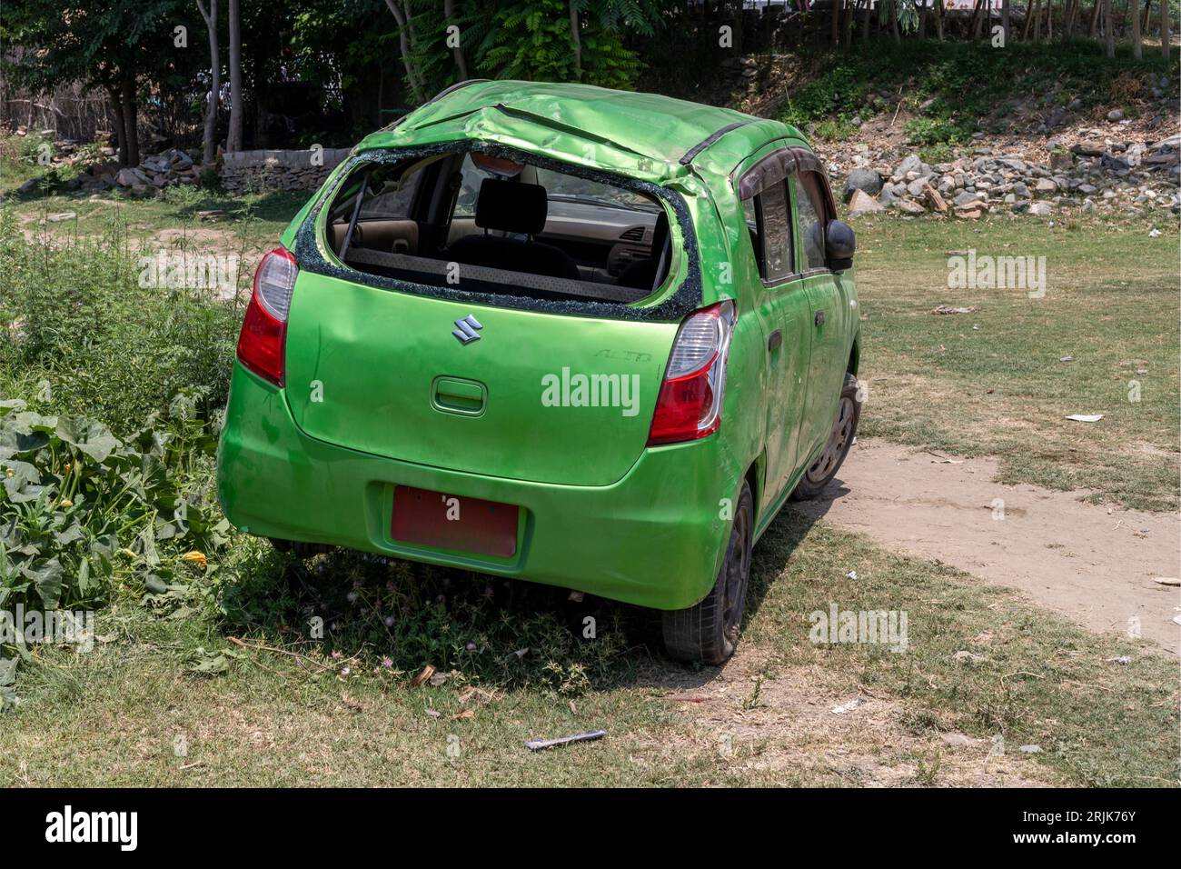 Suzuki alto car totally destroyed in a road accident: Swat,Pakistan - June 10, 2023. Stock Photo
