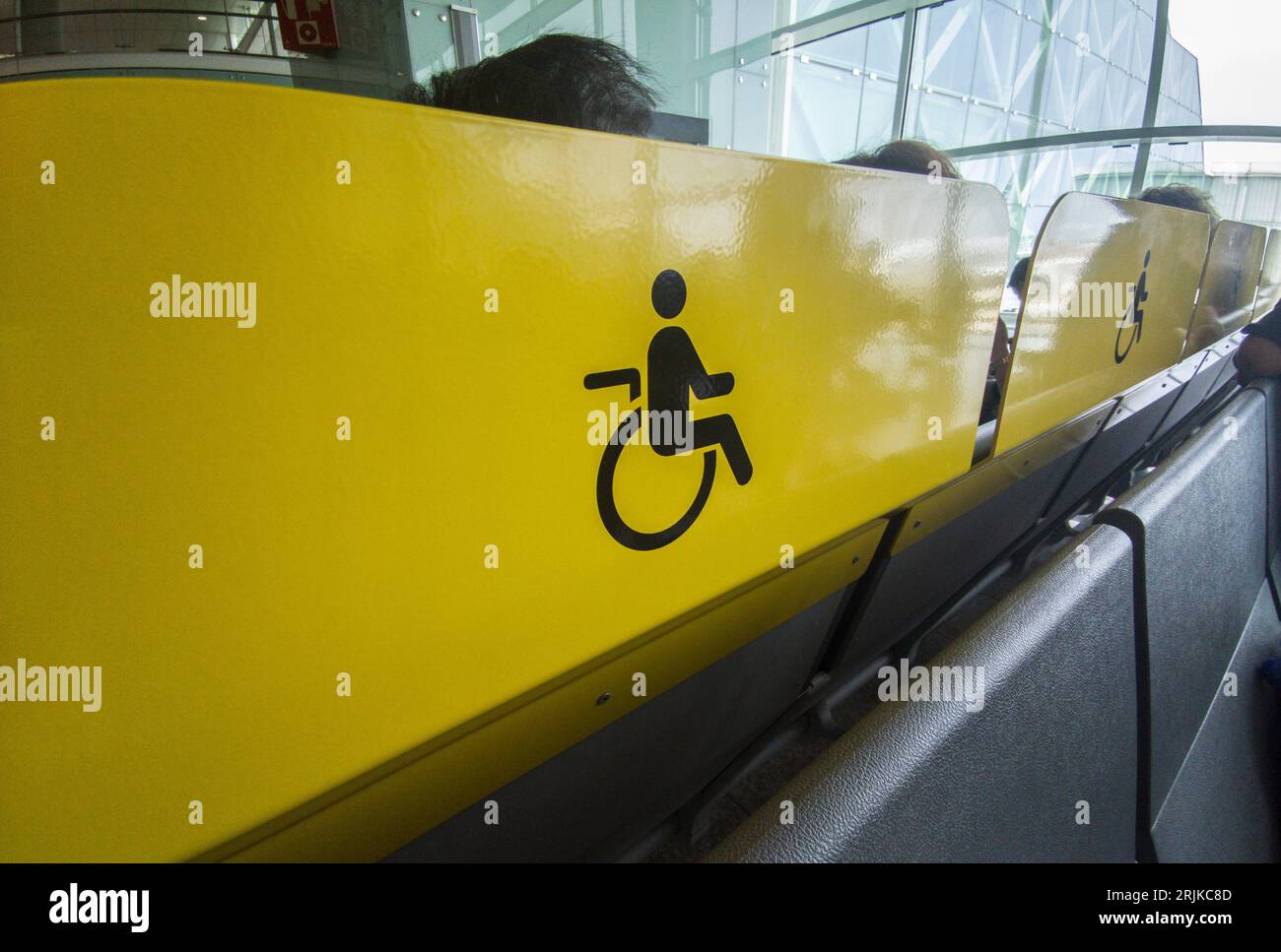 Seats reserved for people with disabilities. Boarding terminal of an airport. Stock Photo