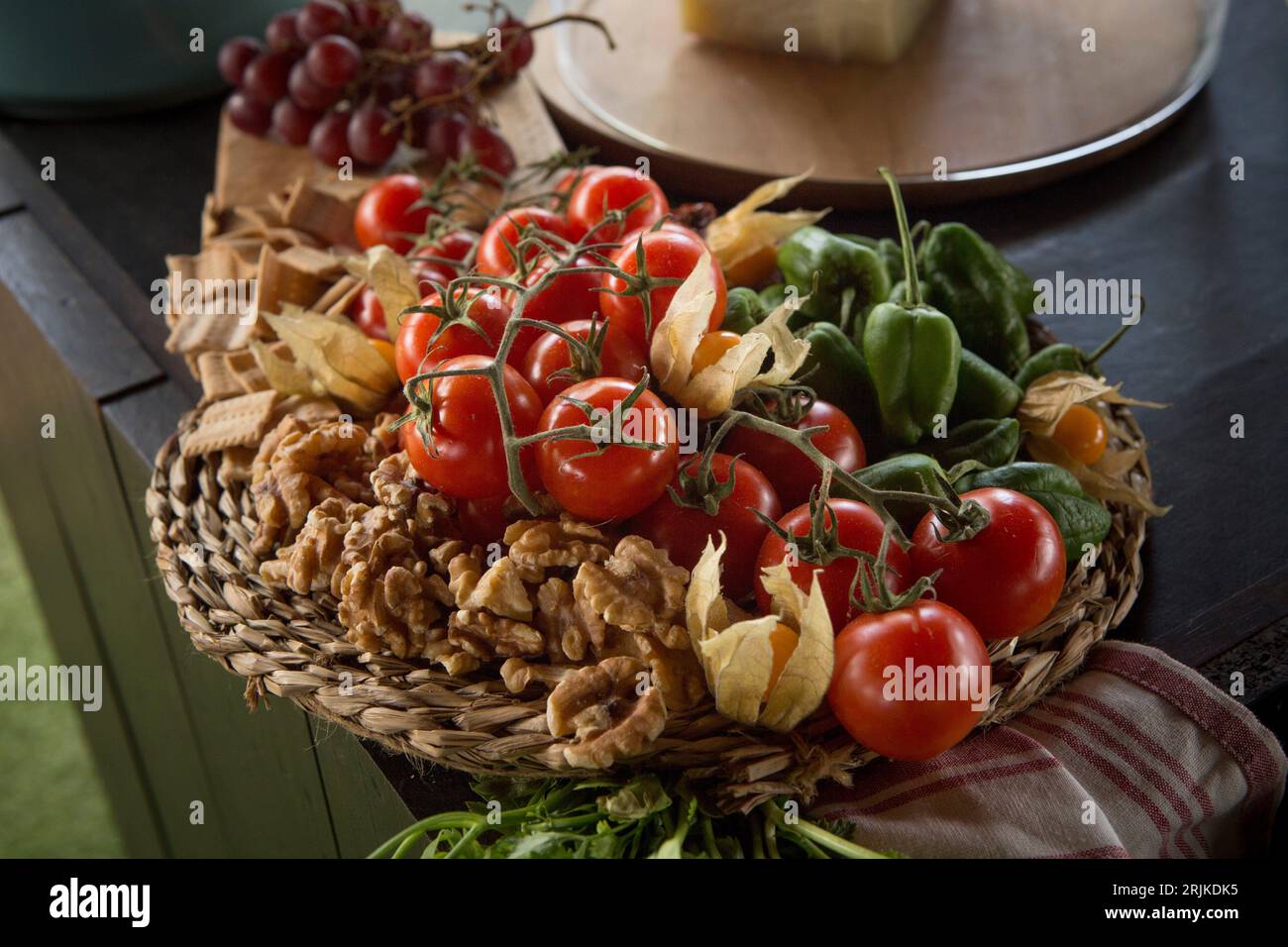 Table composition for cheese display over cattail trivet. Selective focus. Stock Photo