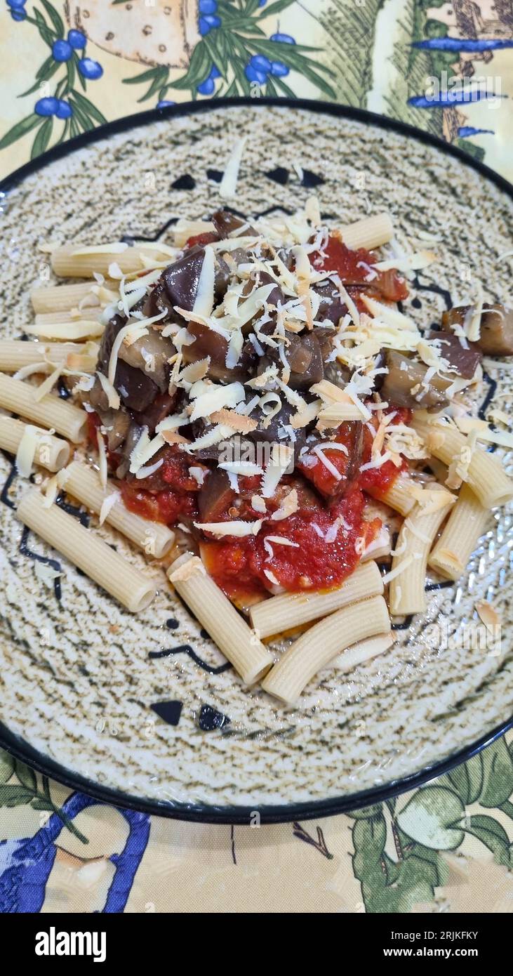 sicily pasta alla norma with fried aubergines, salted ricotta and