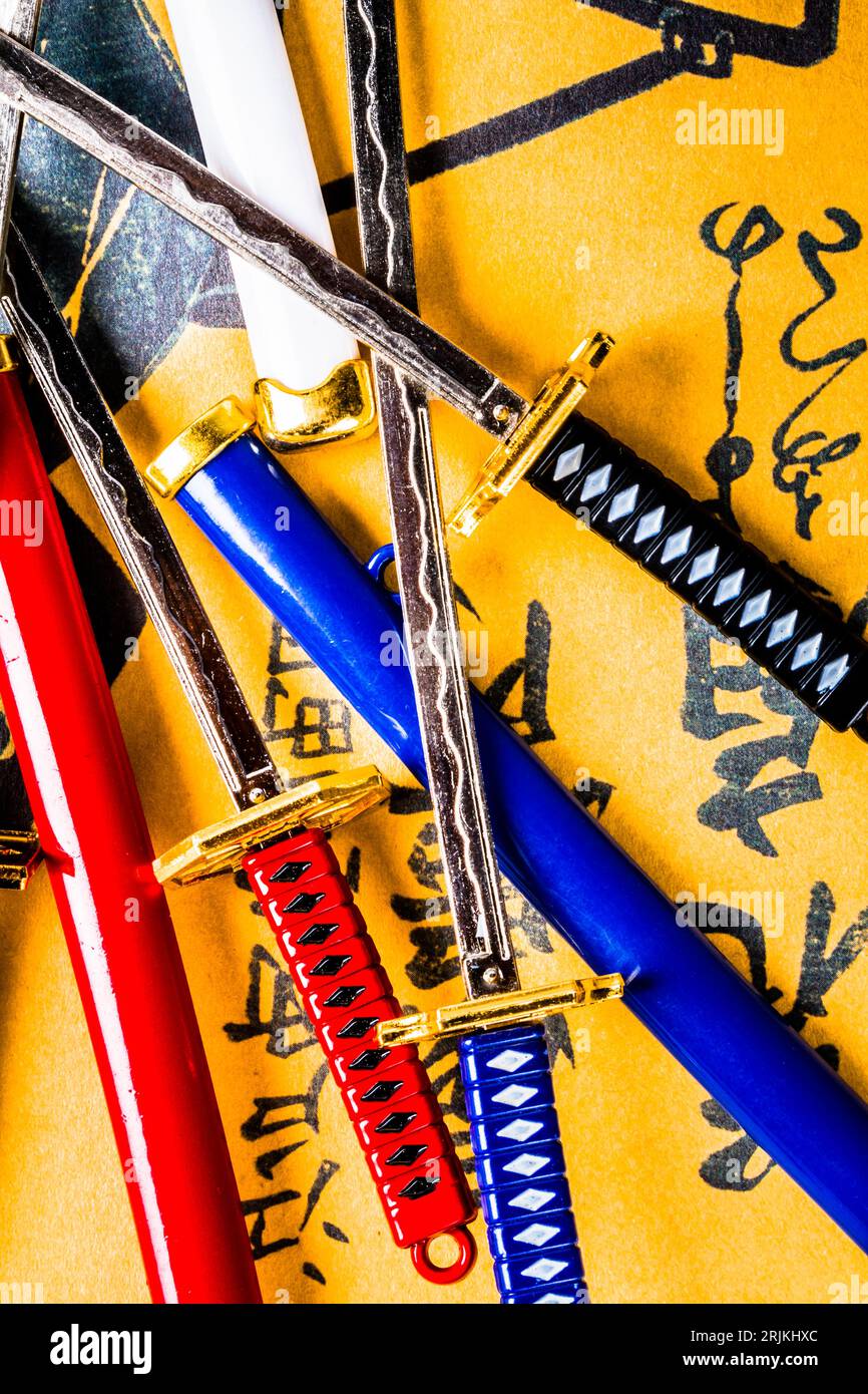 Colourful photo on a mix of martial arts combat swords in Asia styles
