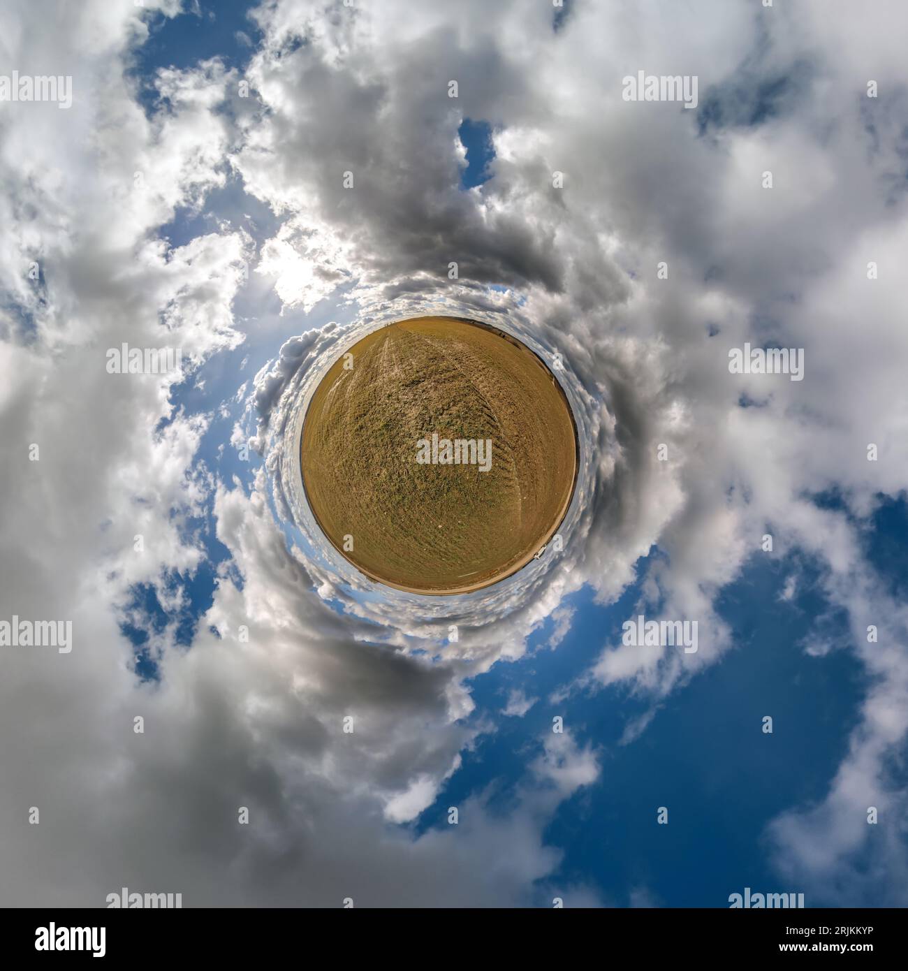 green tiny planet in blue sky with beautiful clouds with transformation ...