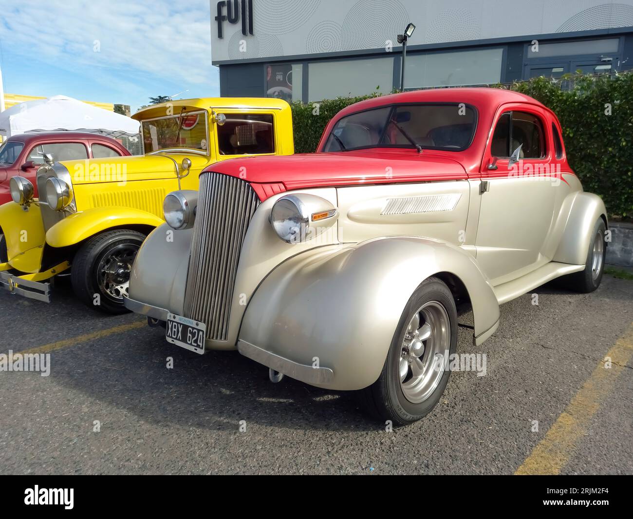 old colorful 1937 Chevrolet Master coupe street rod in a parking lot. Classic car show. Sunny day Stock Photo