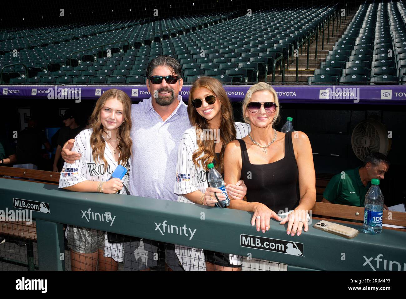 From left, 13-year-old Gentry Helton joins her father, retired Colorado  Rockies first baseman Todd Helton, his 20year-old daughter Tierney and wife  Christy before a baseball game Saturday, Aug. 19, 2023, in Denver. (