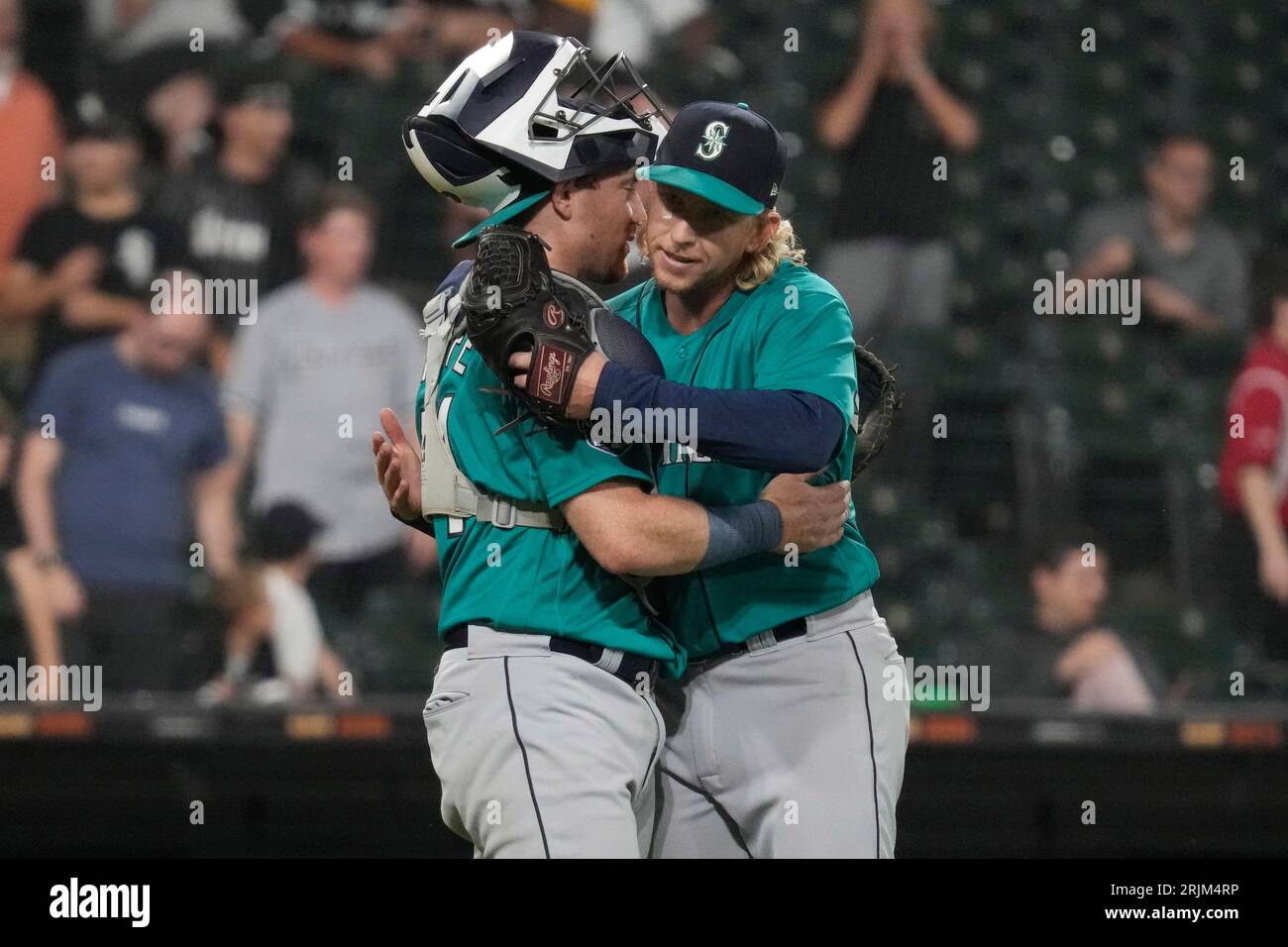 Seattle Mariners catcher Brian O'Keefe, left, celebrates with relief