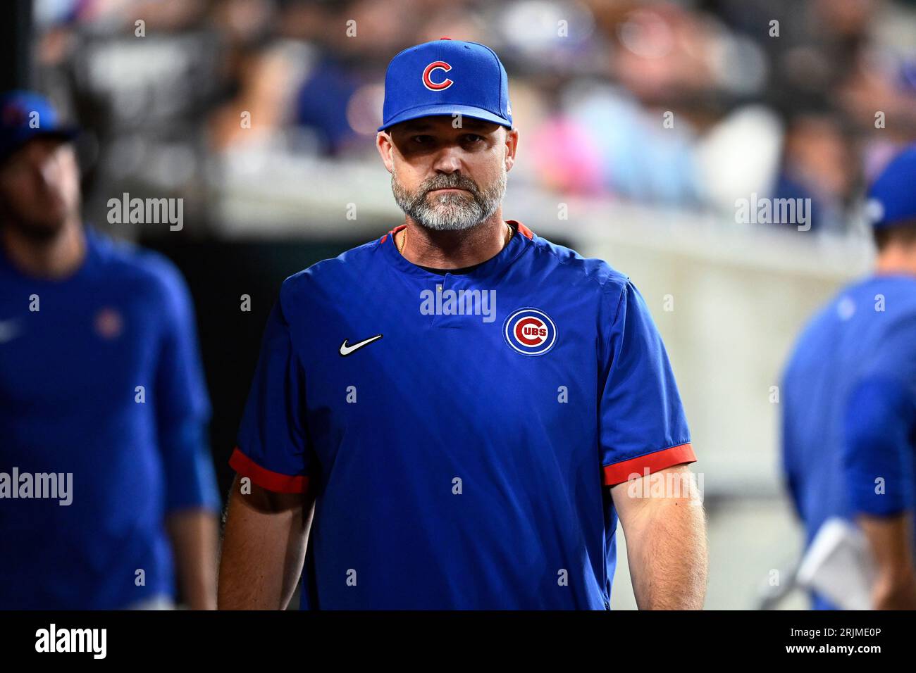 Chicago Cubs manager David Ross walks in the dugout during the eighth
