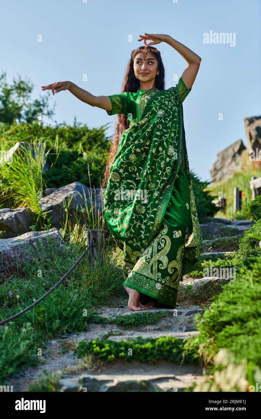 Indian woman standing green hi-res stock photography and images - Alamy