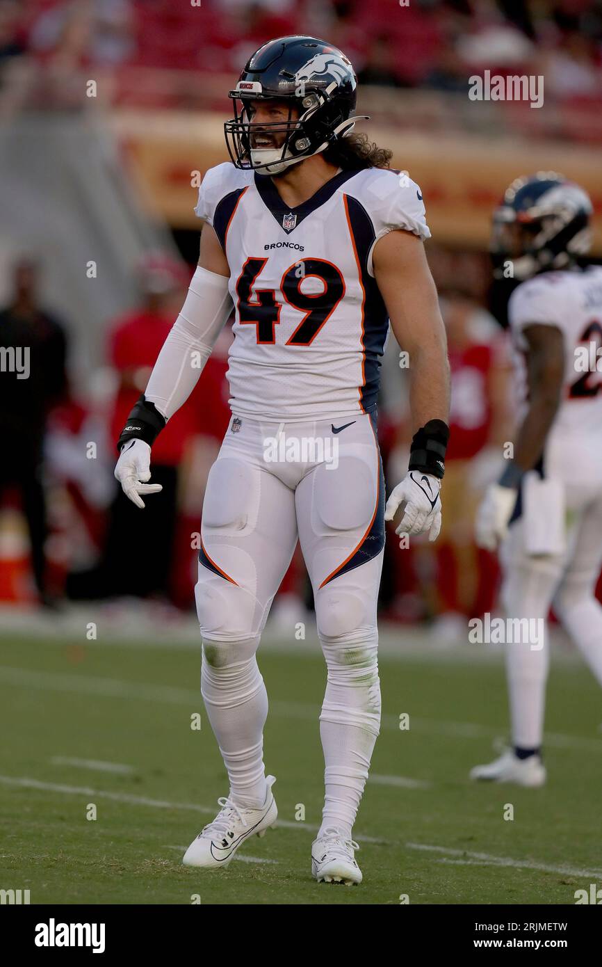 Denver Broncos linebacker Alex Singleton (49) looks into the backfield  during an NFL football game against the San Francisco 49ers, Saturday, Aug  19, 2023, in Santa Clara, Calif. (AP Photo/Scot Tucker Stock