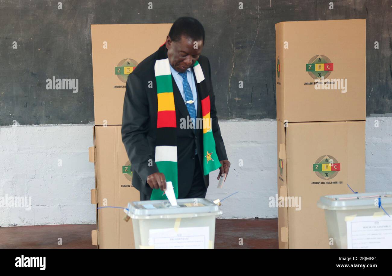 Zimbabwean President Emmerson Mnangagwa Casts His Vote At A Polling ...