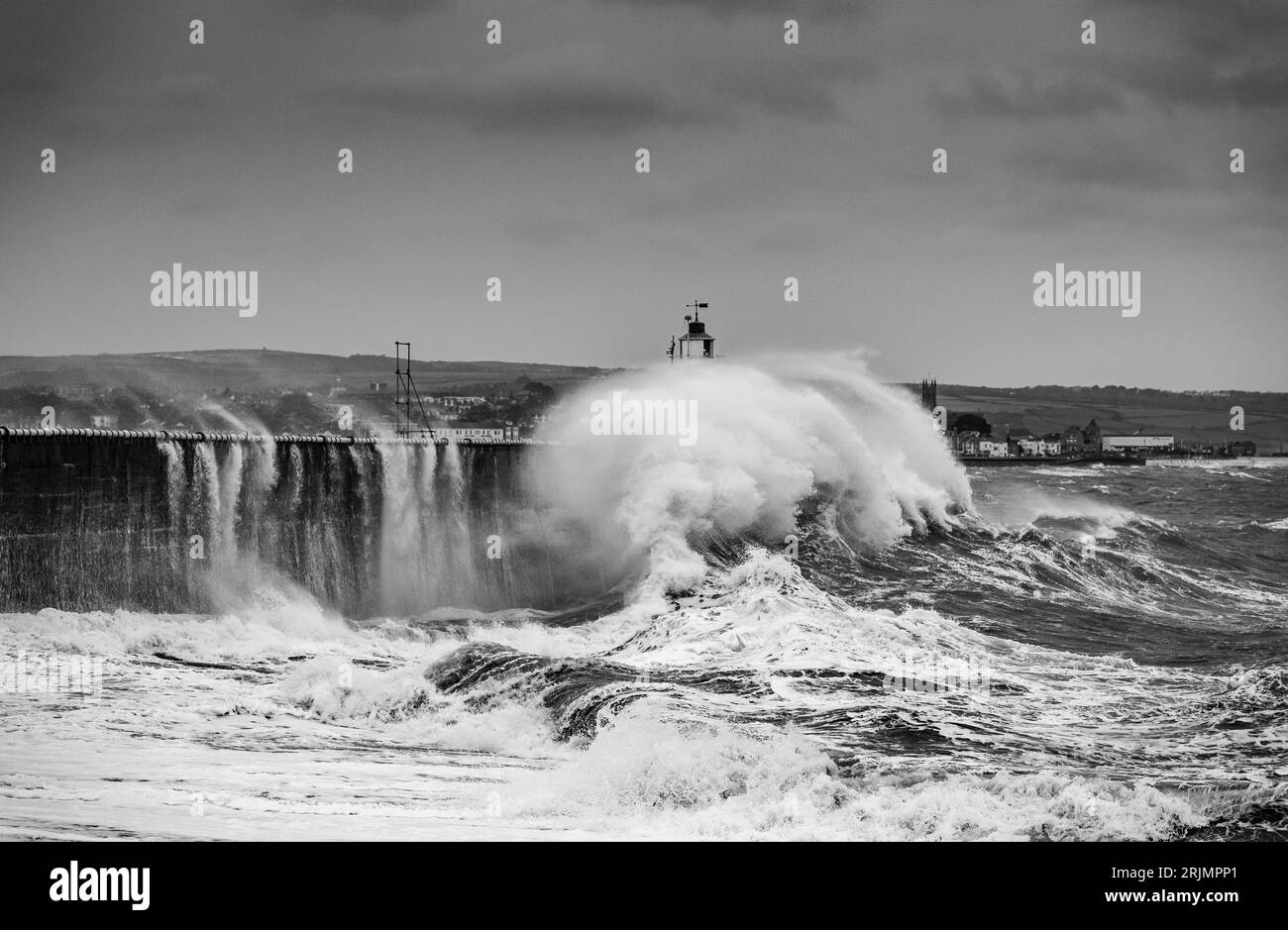 Huge waves crash into Newlyn harbour some reaching as high and above