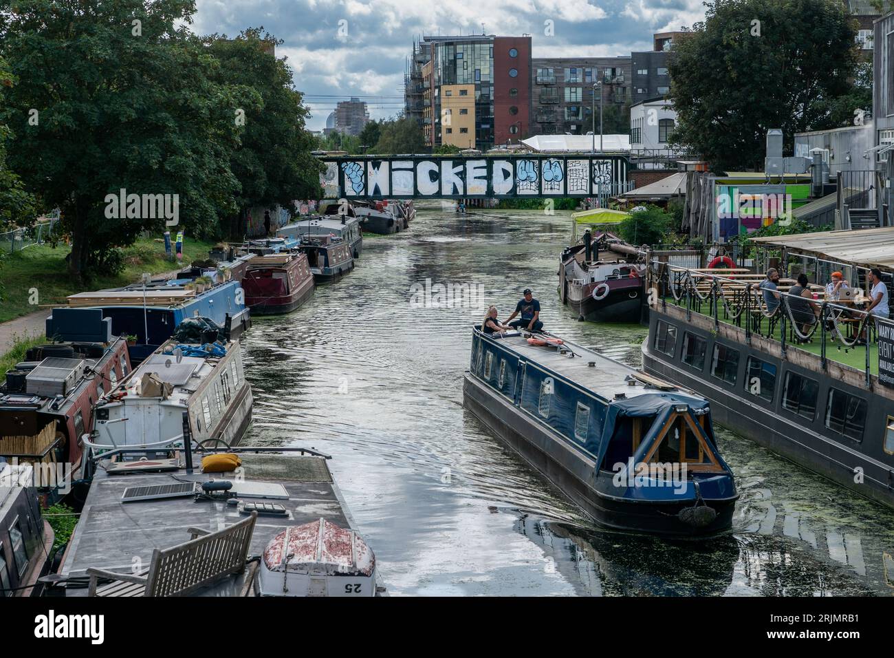People enjoying the hot weather on the River Lea in Hackney, London. Stock Photo