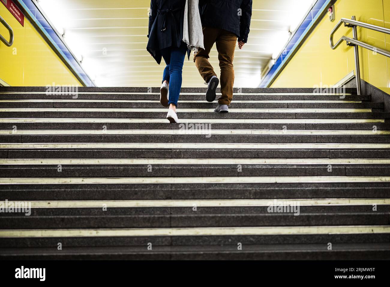 Couple on public transport subway underground train station commute Stock Photo