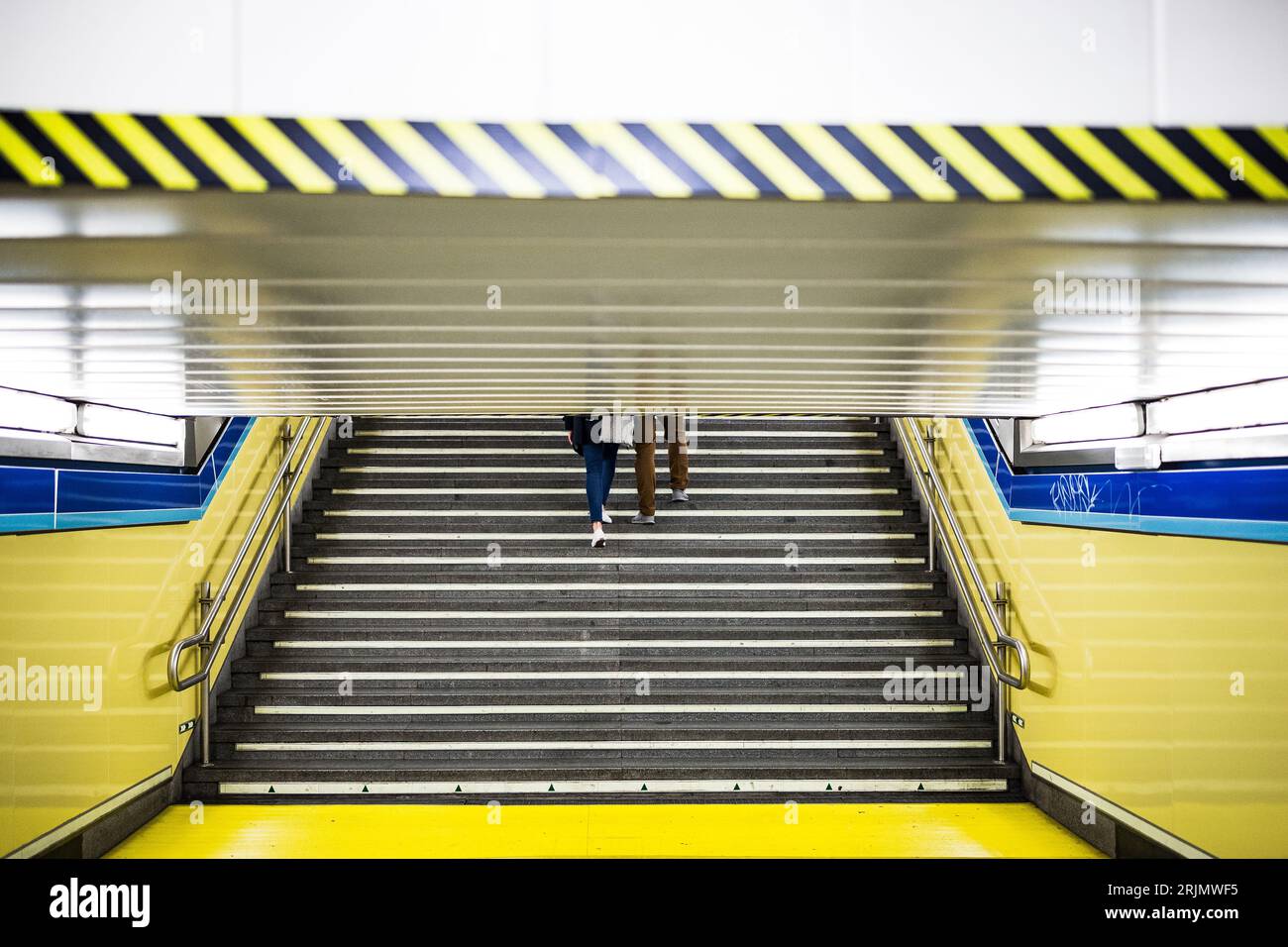 Couple on public transport subway underground train station commute Stock Photo