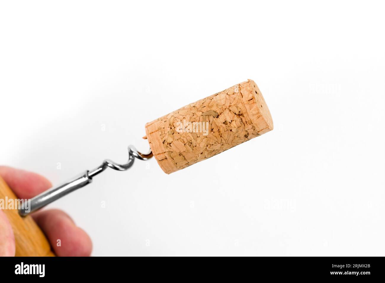 Alcoholism or adulterated wine concept. Wine cork on corkscrew. Stock Photo