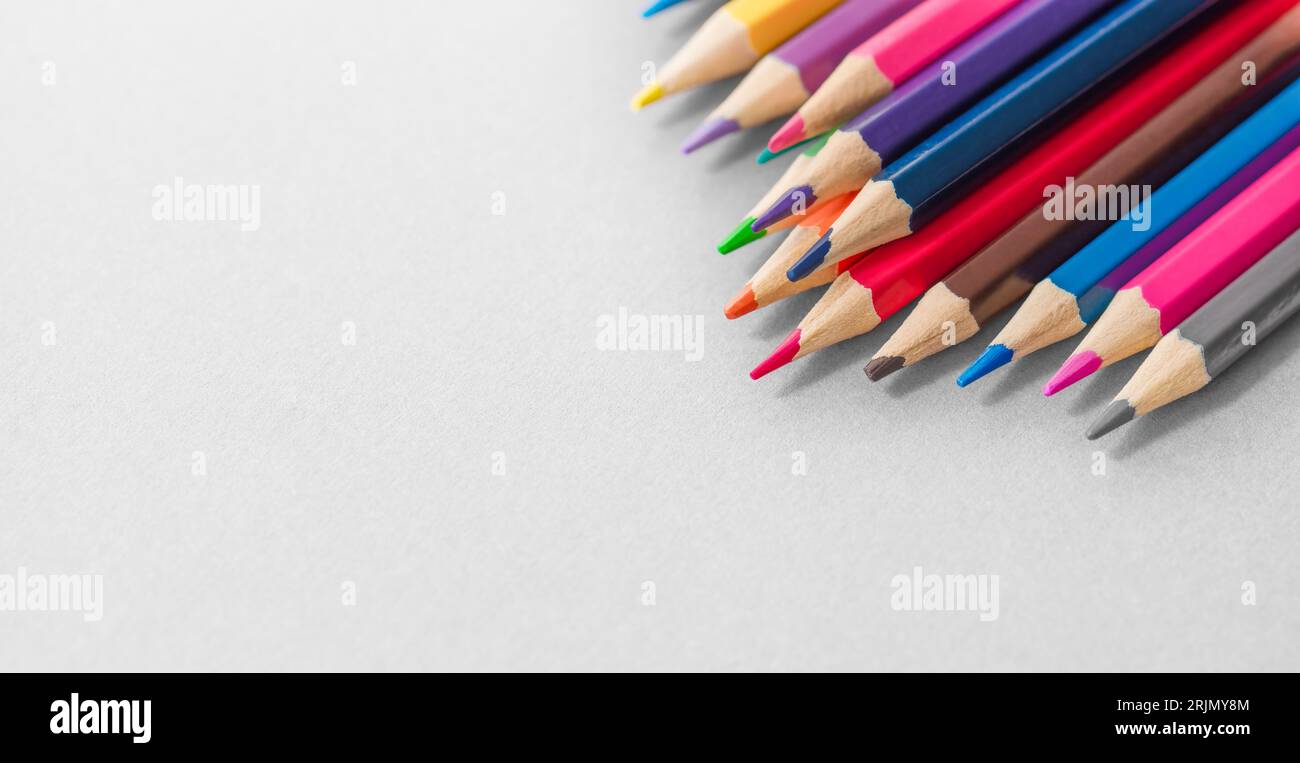 Colored pencils on the grey background. Ready for school stuff. Stock Photo